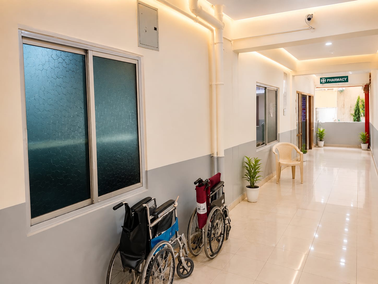 Corridor with wheelchairs leading to the hospital pharmacy